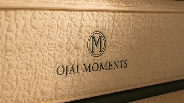 Close-up of Ojai Moments mattress with embroidered logo, highlighting premium materials and luxury construction.