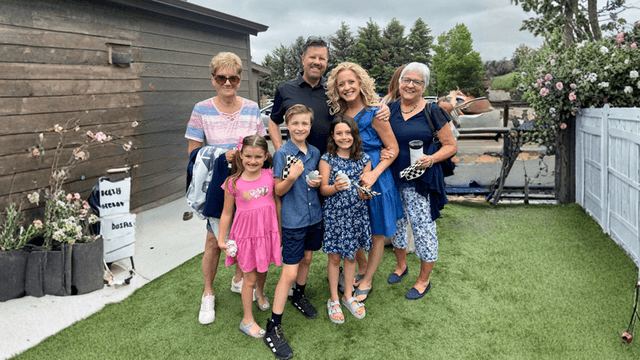 The Cook family smiling together outdoors, representing the family mission behind Empowering Humans Digital Media.