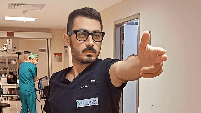 "Dr. Mehmet Fatih Okyay performing surgery, demonstrating his expertise in gender-affirming procedures with care and professionalism."
