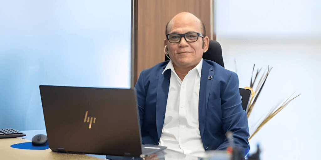 "Anup Singh, founder of dLife Healthcare, leading innovative metabolic health solutions, sitting at his desk, exemplifying leadership and expertise."
