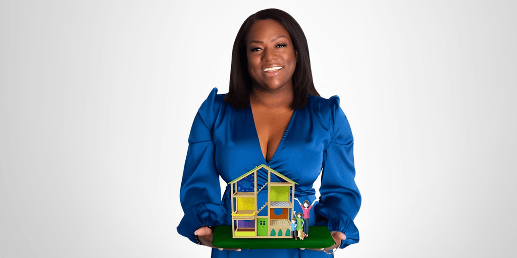 Shantel Morris, Founder of Morris Mission, holding a model house symbolizing her journey from homelessness to empowerment and advocacy.