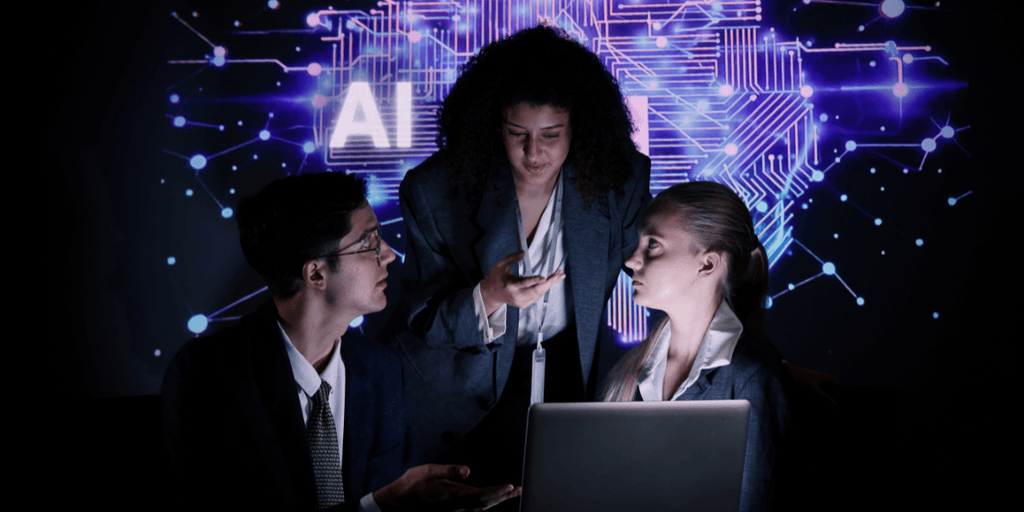 Business professionals collaborating in front of an AI technology display with a laptop.