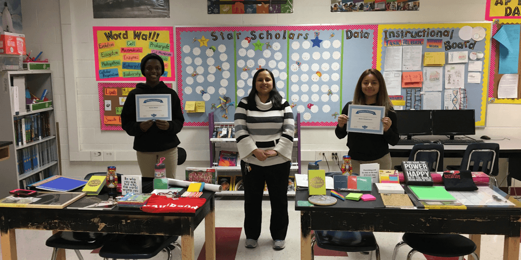 Jessica Samson with students celebrating academic success in STEM, showcasing personalized education and inspiring future leaders in science.