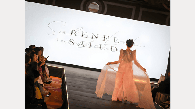 The image features Thalya Cruz at Manila International Fashion Week, showcasing her role as a model, host, and ambassador.