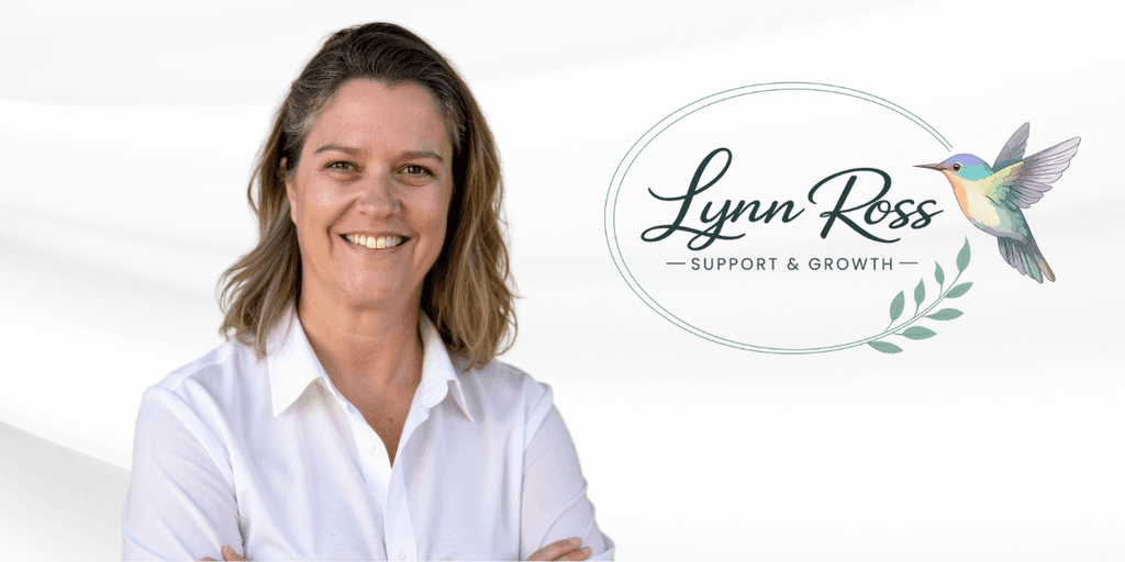 Woman smiling in a white shirt with a logo for Lynn Ross Support & Growth