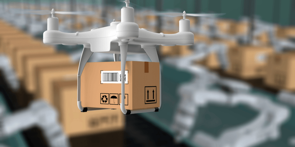 A drone carrying a package above a warehouse filled with stacked boxes