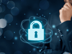 A businessman contemplating cybersecurity with a digital lock symbol on a blue background