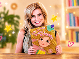 Woman holding a children's book titled "Lily Loves Books" in a bright setting