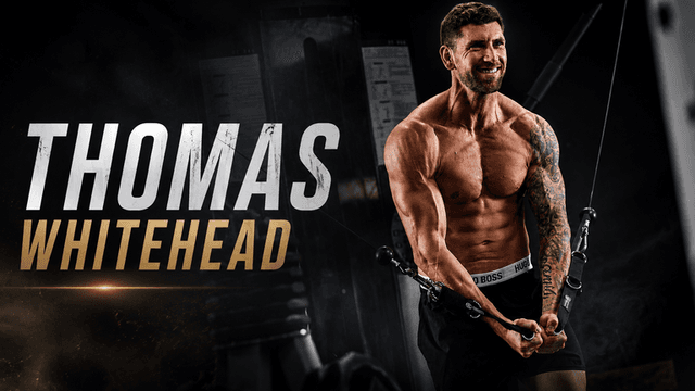 Muscular man performing cable row exercise in gym setting with dramatic lighting
