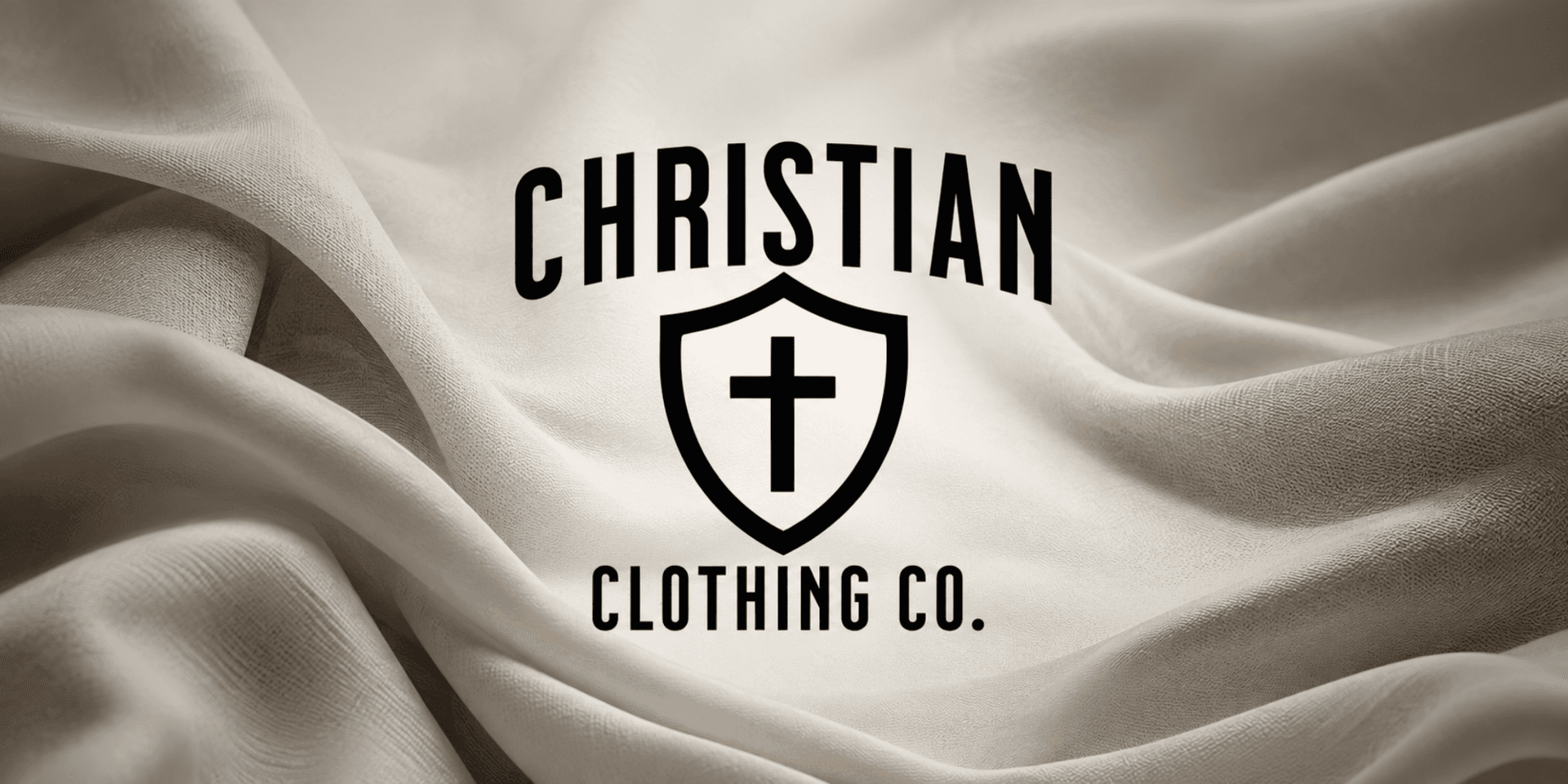 Logo of Christian Clothing Co. over a soft, draped fabric background