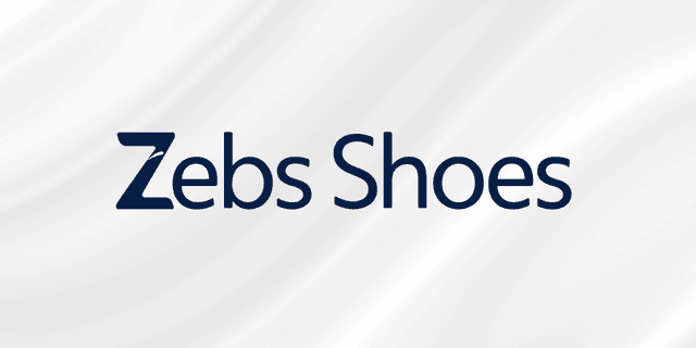 Logo for Zebs Shoes with a simple, modern font on a textured background