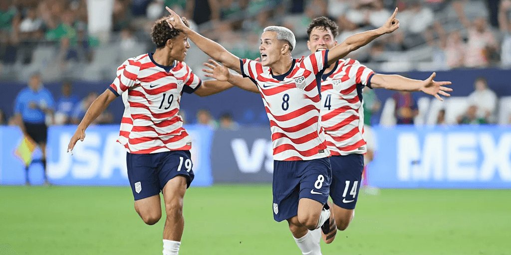 U.S. soccer players celebrate a goal during a match against Mexico