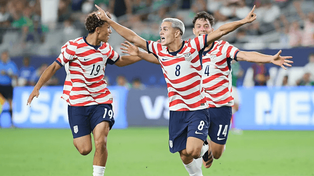 U.S. soccer players celebrate a goal during a match against Mexico