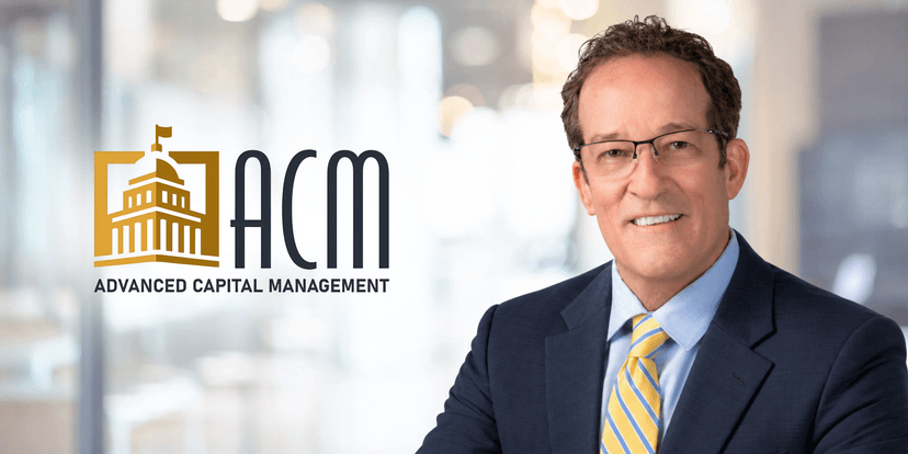 Businessman in a suit smiling beside a logo for Advanced Capital Management