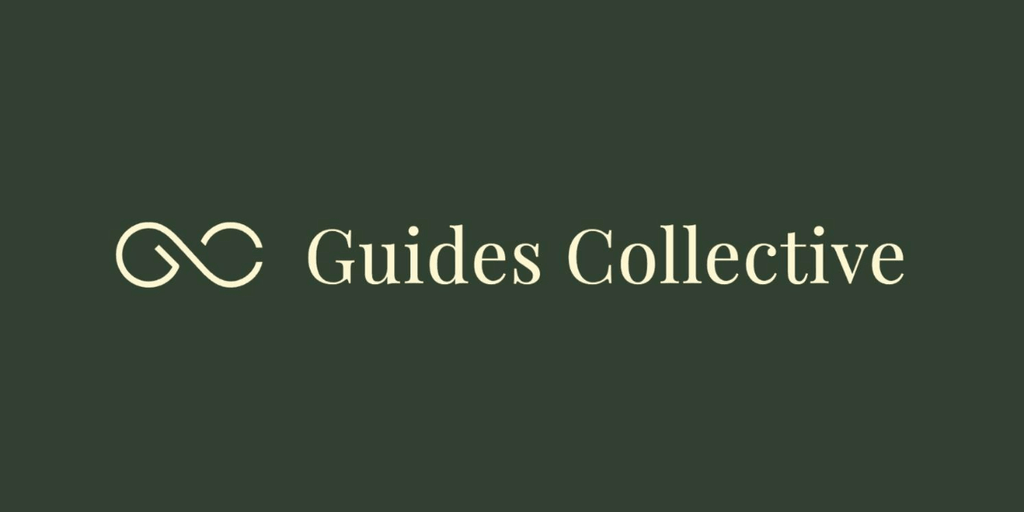 Logo of Guides Collective featuring intertwined symbols and elegant typography on a dark background