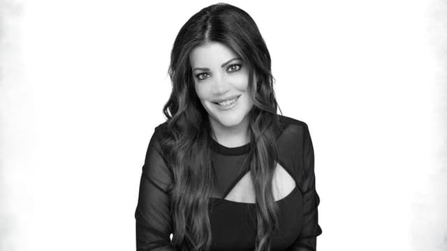 Maria Gallucci, top real estate agent and author, advocating for inclusivity, with a focus on Deaf and LGBTQ+ communities