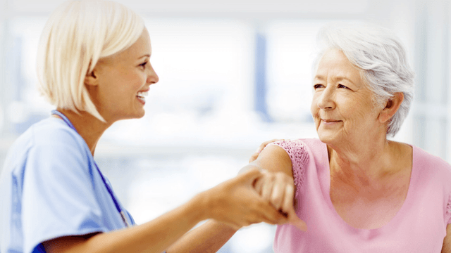 Dr. Chakalos providing compassionate care to a patient, reflecting his holistic approach to chiropractic treatment.