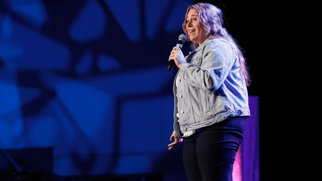 "Daniella Ordonez empowering women through storytelling and business coaching at a speaking event."