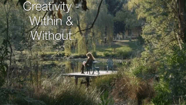 Person writing on a lakeside dock surrounded by trees, symbolizing reflection and creativity.