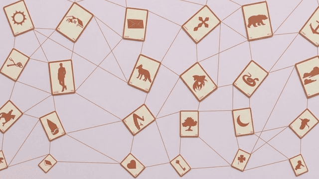 **Lenormand divination cards connected by lines, symbolizing structured card meanings and intuitive insight.**