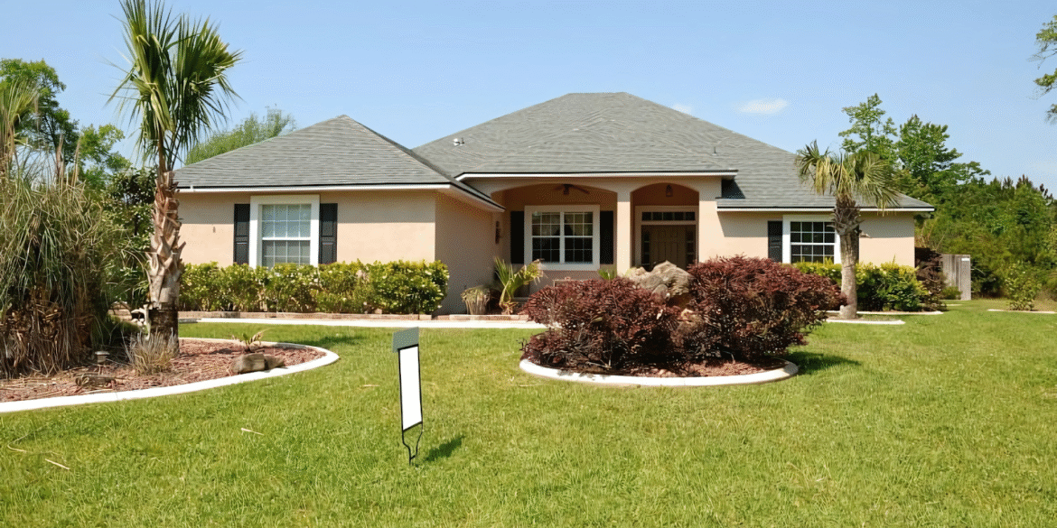 Beautiful home exterior with lush landscaping and palm trees in a sunny neighborhood.