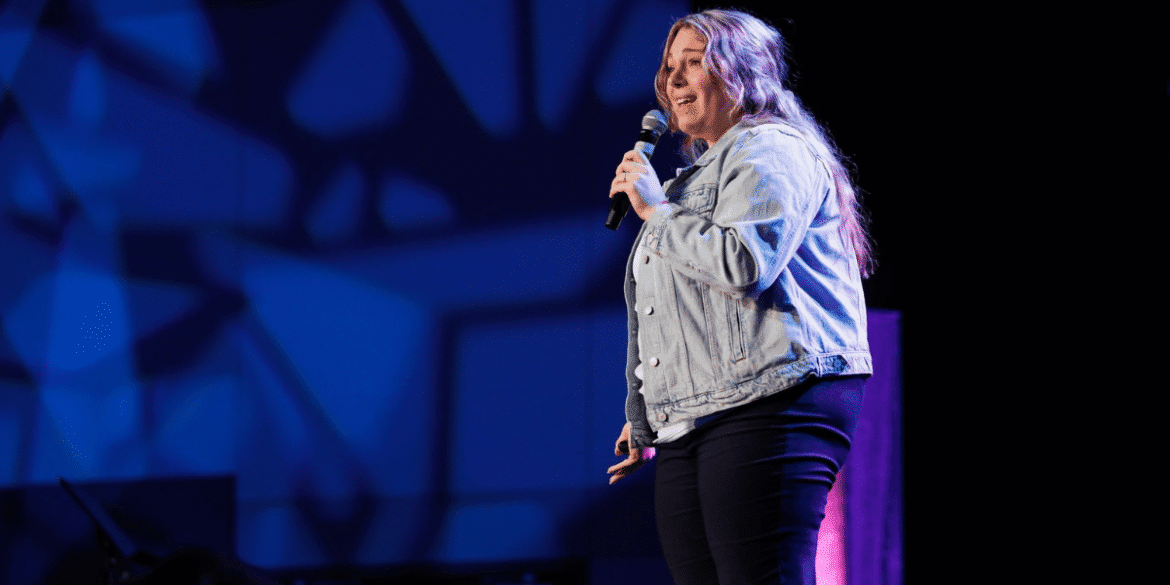 "Daniella Ordonez empowering women through storytelling and business coaching at a speaking event."