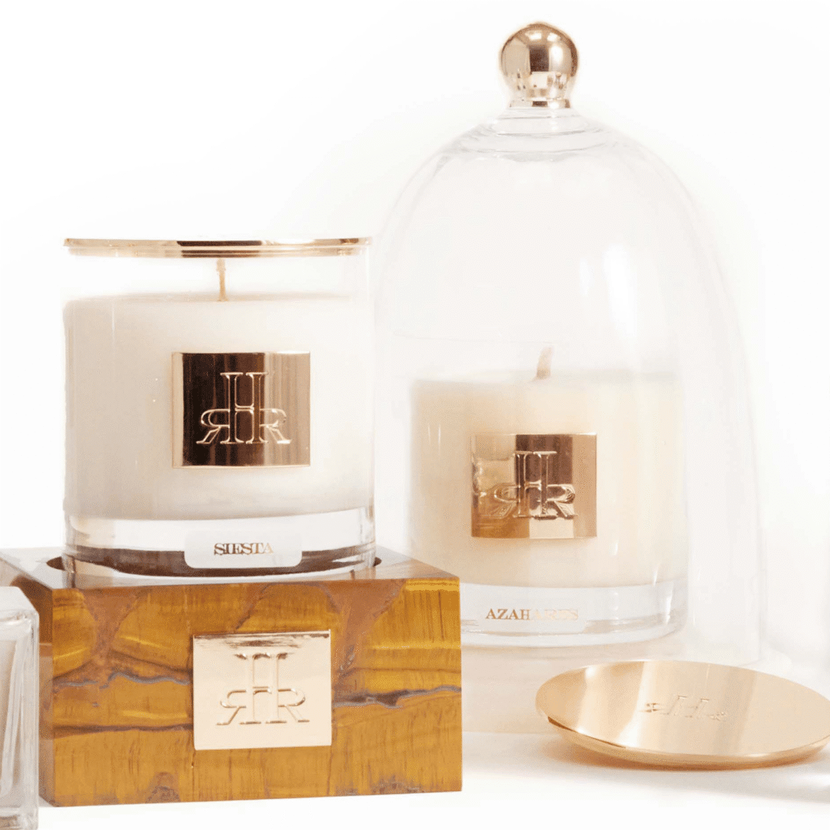 Luxury candles by RHR Luxury, crafted with unique fragrances, gold-plated trims, and elegant design, embodying bespoke craftsmanship and exclusivity.