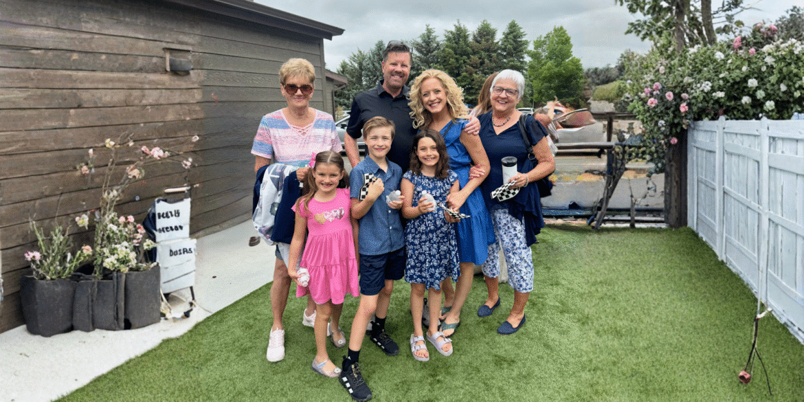 The Cook family smiling together outdoors, representing the family mission behind Empowering Humans Digital Media.