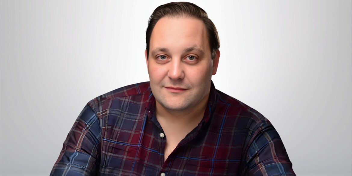 Chris Kendall, a renowned voiceover artist, poses for a professional portrait, embodying authenticity and experience in broadcasting.