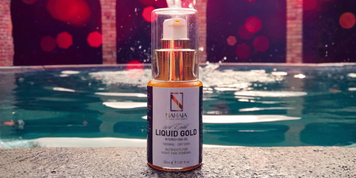 "NAHAia Active Organics 24K Gold Nourishing Oil, with luxurious organic ingredients and energy-infused skincare, set against a serene pool background."