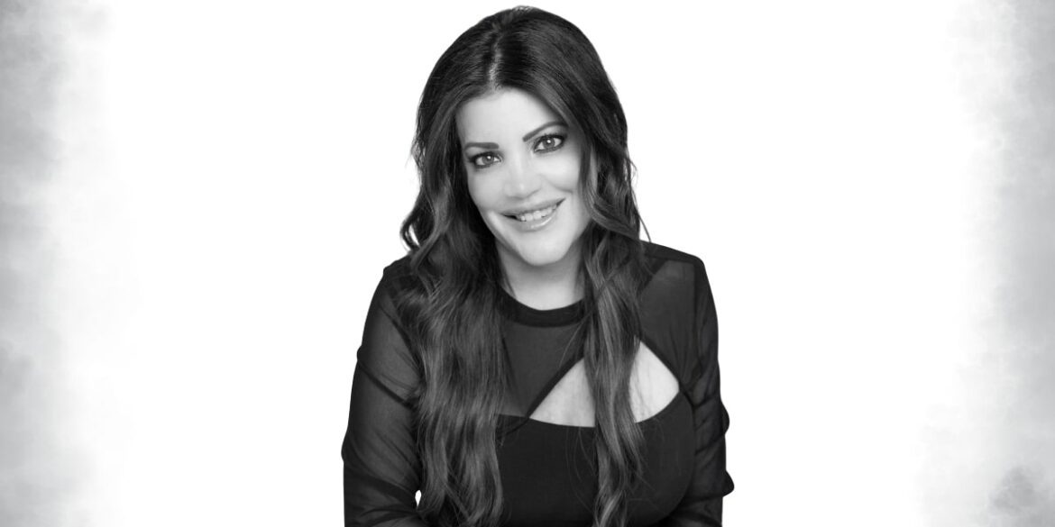 Maria Gallucci, top real estate agent and author, advocating for inclusivity, with a focus on Deaf and LGBTQ+ communities