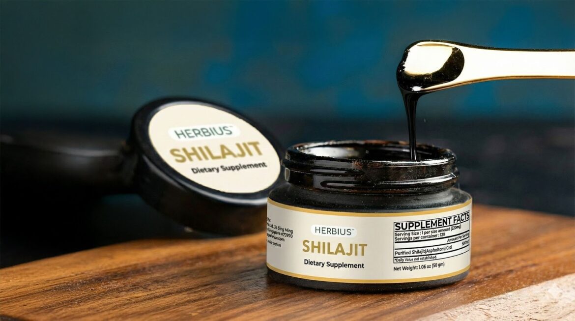 A jar of Herbius Pure Shilajit dietary supplement with a golden scoop, showcasing the natural, potent shilajit resin.