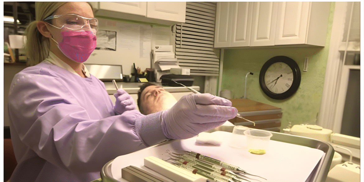 A dental professional performing Enhanced Scaling and Root Planing (ESRP) with advanced technology for periodontal care.