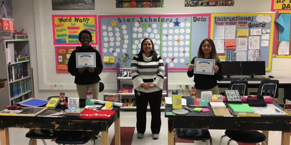 Jessica Samson with students celebrating academic success in STEM, showcasing personalized education and inspiring future leaders in science.
