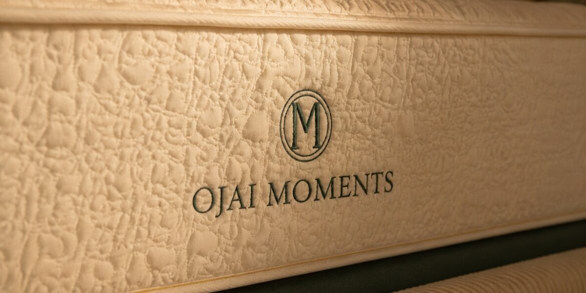 Close-up of Ojai Moments mattress with embroidered logo, highlighting premium materials and luxury construction.