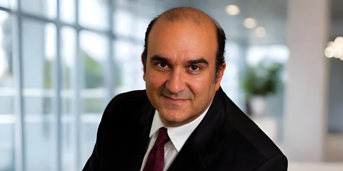 Enzo Calamo, CEO of Lugen Family Office, poses confidently in a professional setting, reflecting his expertise in legacy planning.