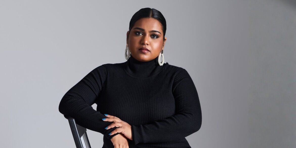 The image features Elizabeth, founder of Silver Queen, in a black turtleneck, exuding strength and confidence.